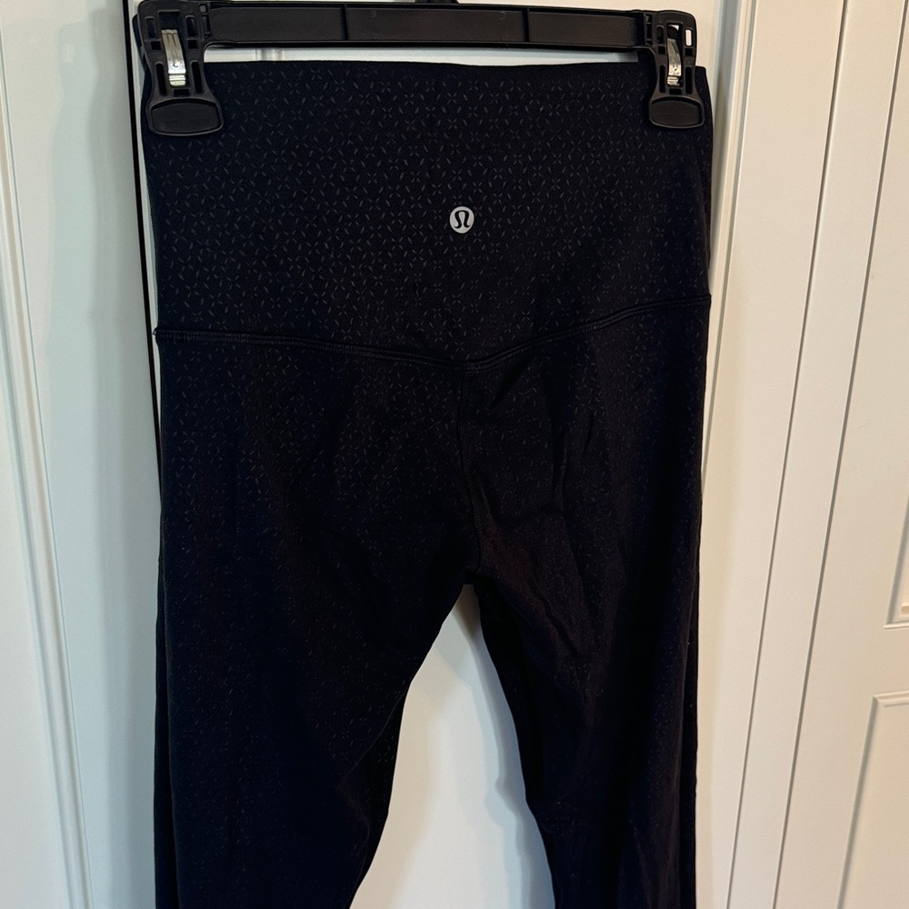 Unique Lululemon Black High-Rise Leggings with shiny detail pattern